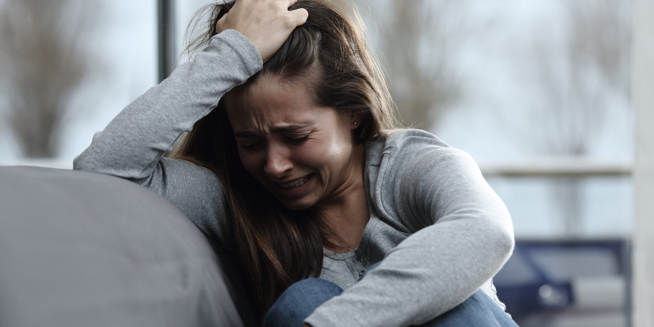 Sad girl complaining and crying at home